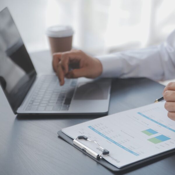 Person analyzing data on a laptop