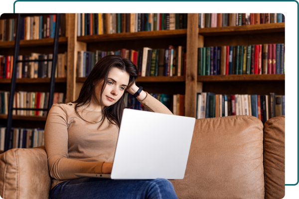 A woman staring at her laptop